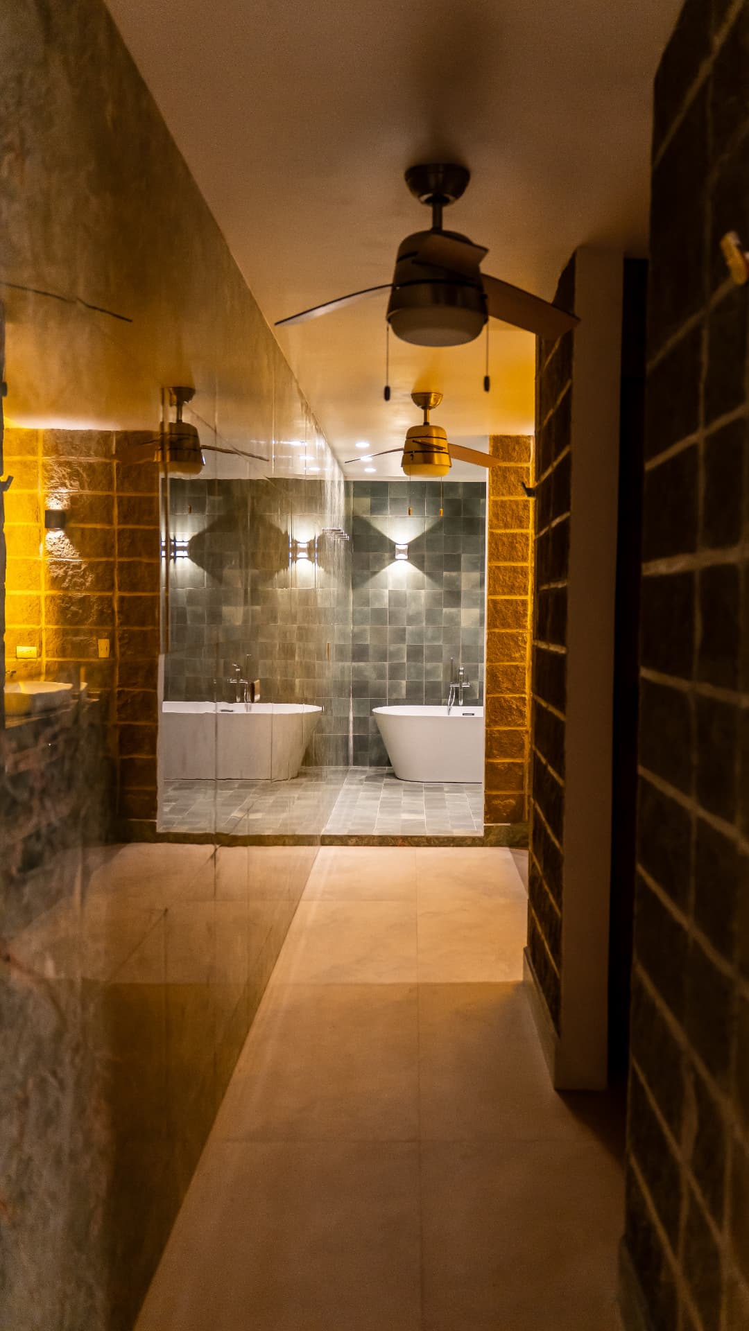 Corridor leading to the tub and bathroom of a suite